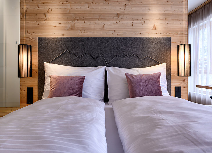 Comfy king-size beds in the Tirol Lodge in Ellmau